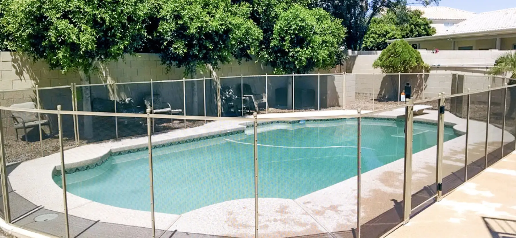 A Roman swimming pool in North Georgia surrounded by pool fences.